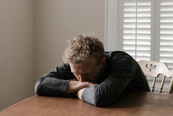 Anxious man at table
